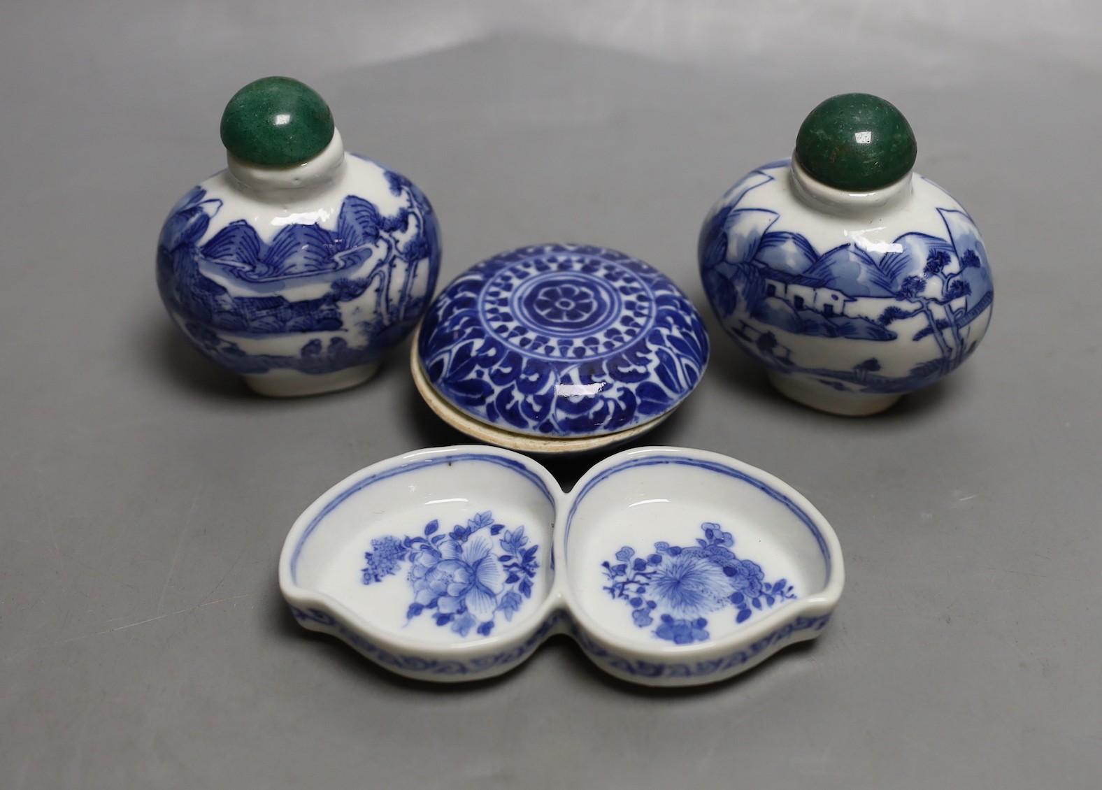 A Chinese blue and white seal paste box, brushwasher and a pair of snuff bottles, late 19th/early 20th century